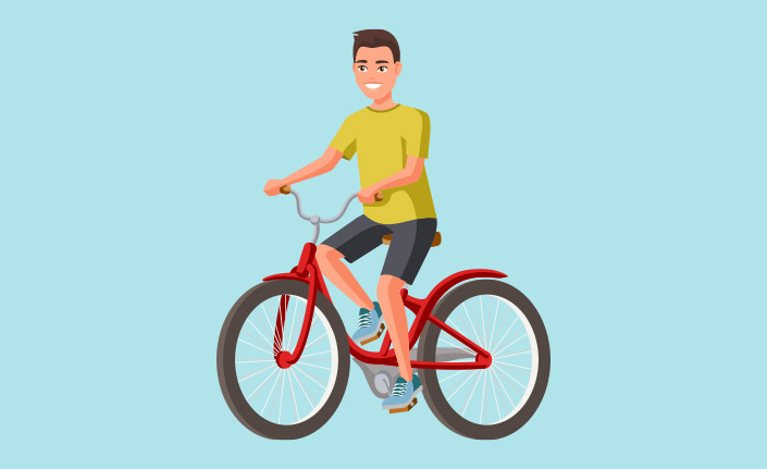 Dreng cykler paa cykel